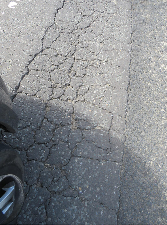 cracking-4-(1).jpg Severe alligator cracking on the road